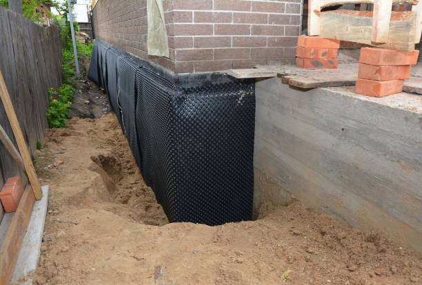 Happy homeowners after waterproofing job in Waynetown